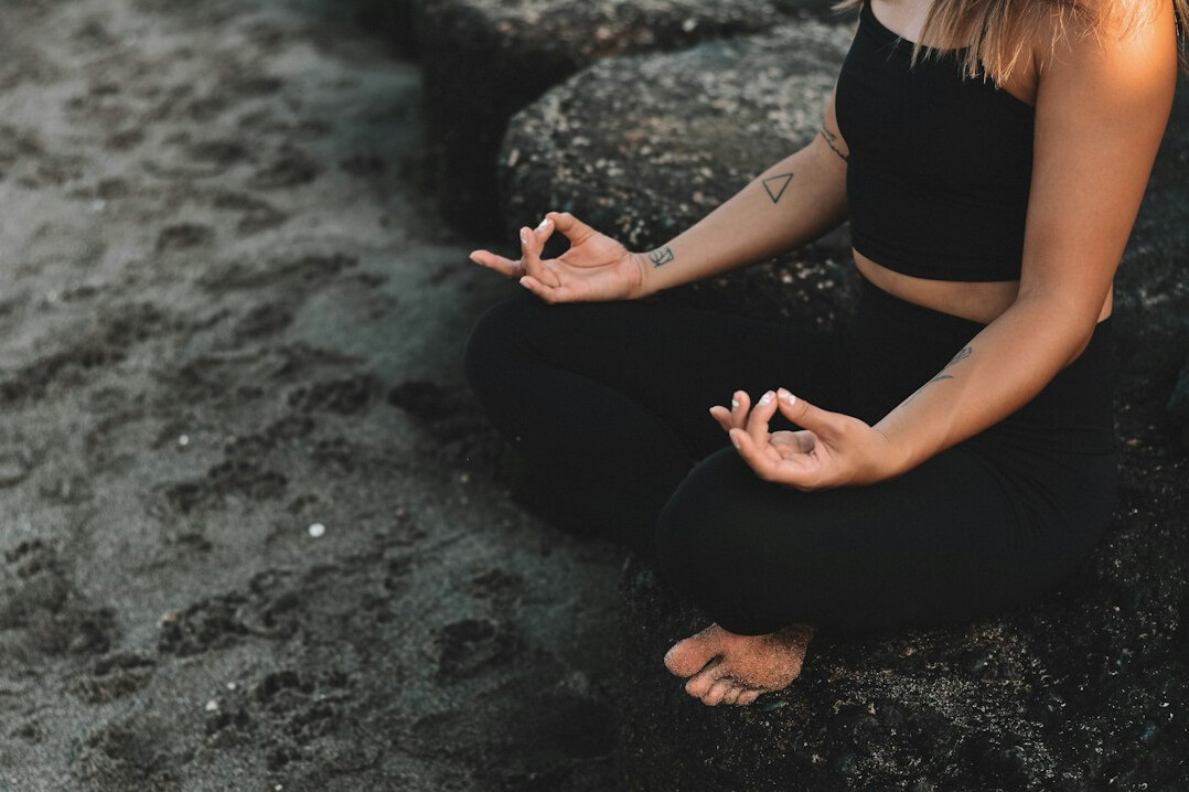person meditating alone