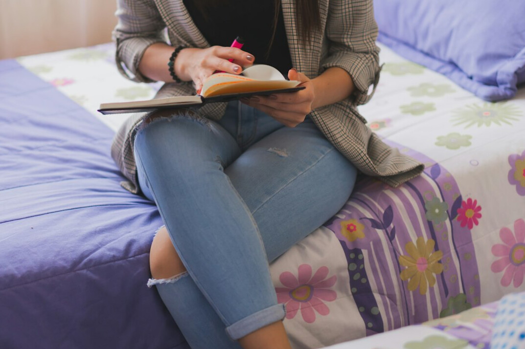 person journaling at home